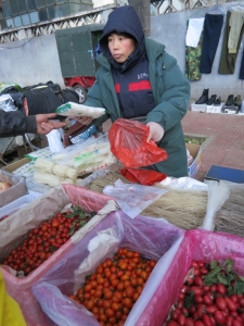 At the farmer's market, buying noodles and tomatoes