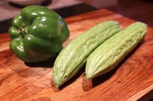 From lest to right: one green bell pepper and two bitter melons